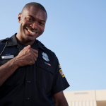 cop in uniform against blue sky