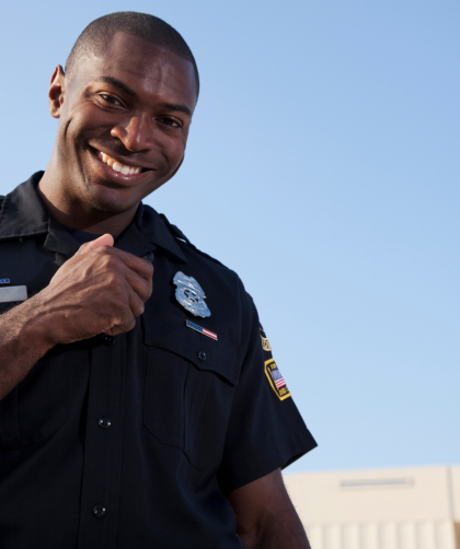cop in uniform against blue sky